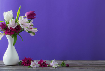 beautiful spring flowers in white vase