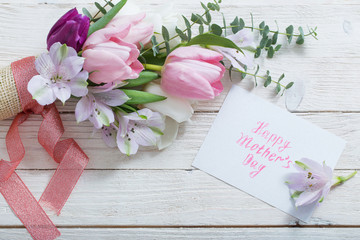 Tulips on white wooden background. Concept  mother's day top vie