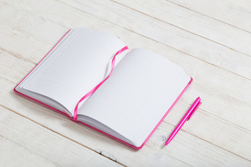 notebook on white wooden background