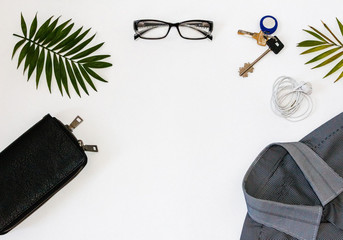 Flat lay, Man Items in all Black on a White Background.Office workplace with glasses, wallet and business classic men's shirts on table. Business, office concept. Working process.Men's Accessories. 