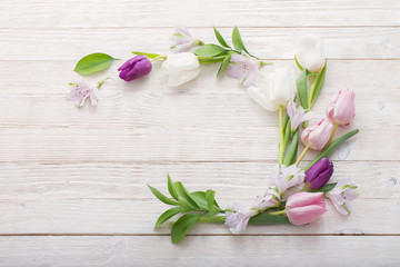 Tulips on white wooden background. Concept woman's or mother's d