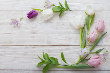 Tulips on white wooden background. Concept woman's or mother's d