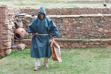 Native american man wearing raincoat in the countryside.