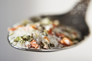 Spoon with sea salt with seasonings close-up - 251734548