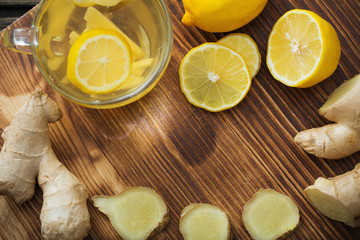 ginger and lemon tea on wooden background