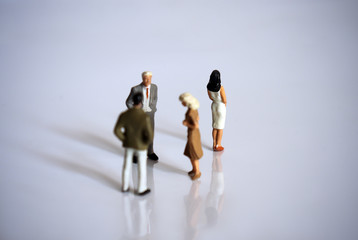 Miniature people. The concept of bullying in the workplace.