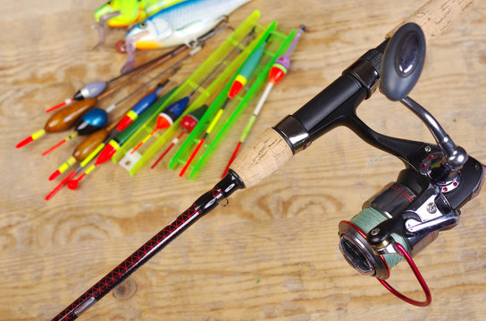 Fishing floats and fishing gear on a wooden table