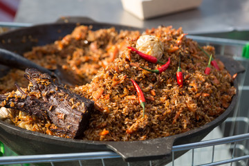 Traditional pilaf rice dish in a cauldron