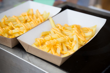 French fries served with cheese sauce