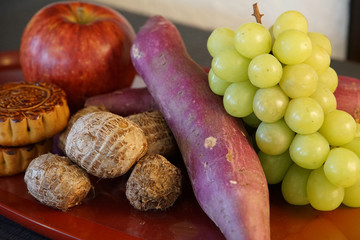 Food such as grapes and apples placed on the table