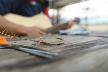 Changing acoustic guitar chord.