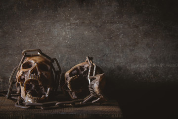 Skull dead with chains in dark tone image style 