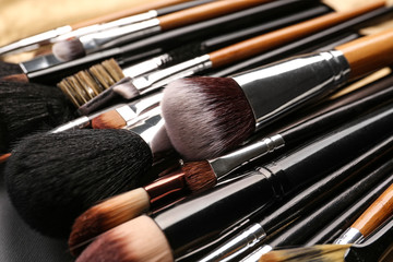 Set of makeup brushes on table, closeup