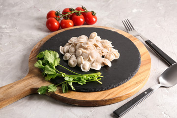 Tasty dumplings on slate plate