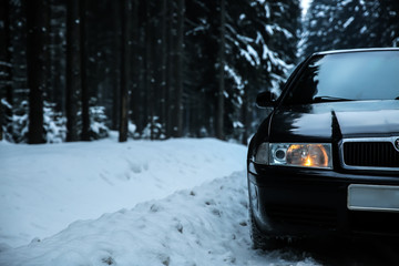 Car on road at snowy winter resort