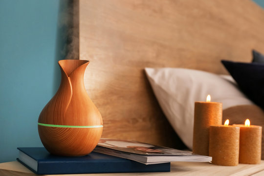 Aroma Oil Diffuser On Table In Bedroom