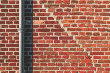 Abstract Red Brick Texture With Pipe