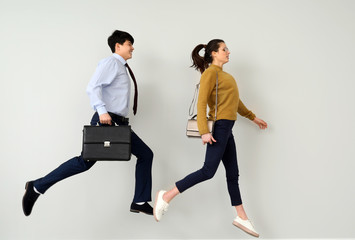 Running young people against light background