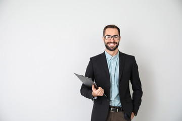 Portrait of young businessman on light background
