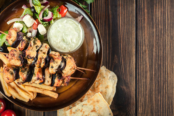 Chicken Souvlaki with french fries and tzatziki sauce