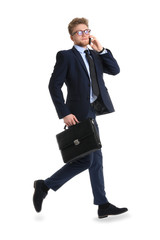 Jumping businessman with stylish briefcase and mobile phone on white background
