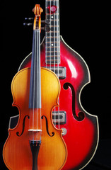 Fototapeta na wymiar Electric guitar and violin on a black background