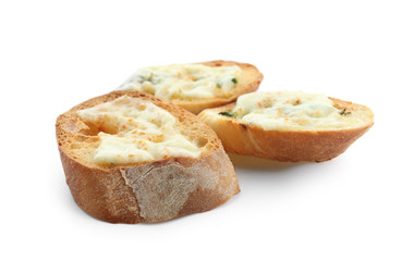 Sliced bread with cheese and garlic on white background