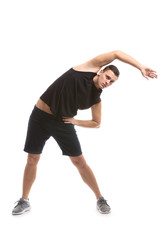 Sporty young man training against white background