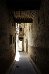 Fototapeta na wymiar A narrow street at the Medina of Fez, Morocco