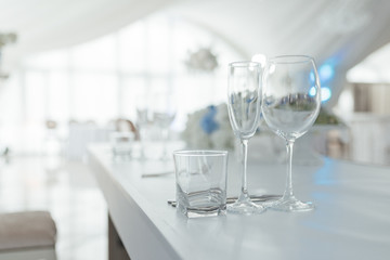 transparent wine glasses on a light table