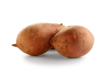 Raw sweet potato on white background