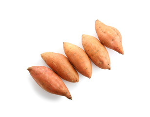Raw sweet potato on white background