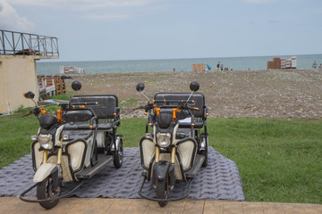 Bycicle rent in Batumi, Georgia. Electric tricycle scooters for rent on Batumi New Boulevard