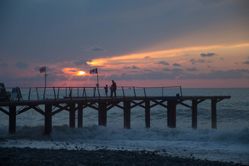 over Terrace dock or pier. Dock sea and cloudy sky background, sunset. The city embankment