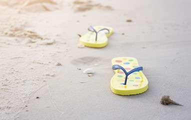 Flip flop on sand in holiday 