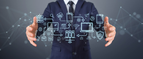 Businessman using tech devices and icons thin line interface