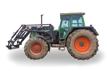Side view of a powerful tractor designed for various works on a country farm. Closed saloon, red wheels. Isolated photo.Equipment for a dairy farm.
