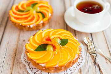 Jelly baked cake with jelly and fresh fruits, grapefruit, grapes and orange