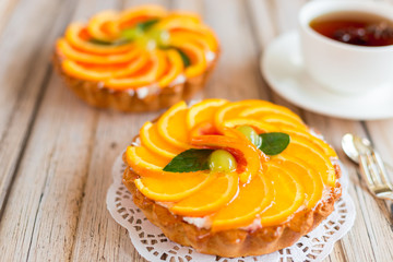 Jelly baked cake with jelly and fresh fruits, grapefruit, grapes and orange
