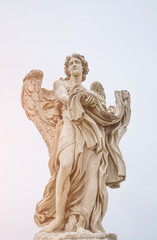 Fototapeta na wymiar Bernini statue of angel in Rome, famous turist landmark in Italy.
