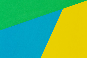 Geometric flat lay yellow green blue color paper background
