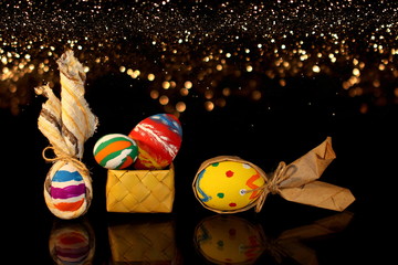 beautiful colorful, painted Easter eggs on a shiny background