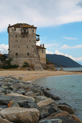 Fototapeta premium Old tower at the beach in Ouranoupoli, Athos peninsula, Chalkidiki, Greece