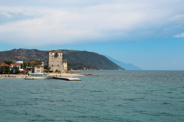 Old tower at the beach in Ouranoupoli, Athos peninsula, Chalkidiki, Greece