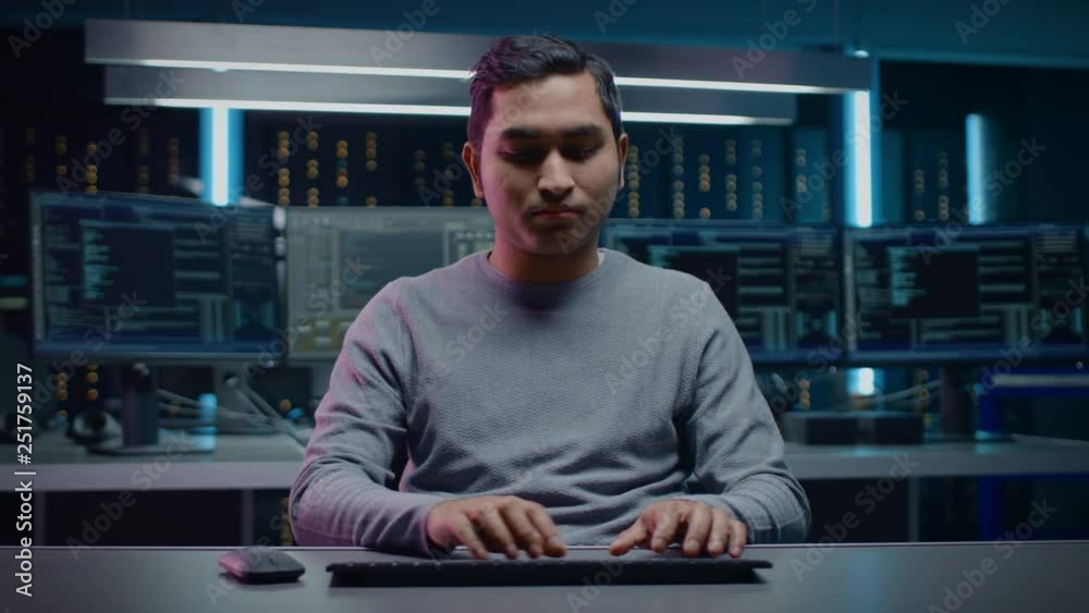 Aufkleber Portrait of Software Programmers Sitting at His Desk and Working on Computer in Digital Identity Cyber Security Data Center. Hacking or Programming. POV Camera Shot