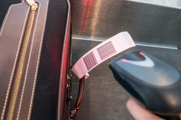 Laser scanner barcode reader scanning for loading luggage bag