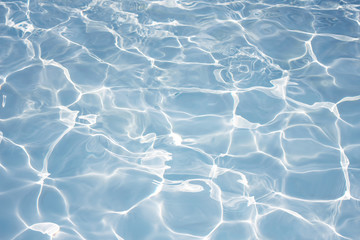 Texture of water in swimming pool for background