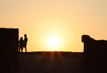 Fototapeta na wymiar silhouette of couple at sunset