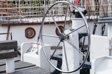 Steel steering wheel on yacht
