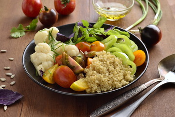 Vegetarian salad with quinoa, vegetables and sunflower seeds. Buddha bowl.